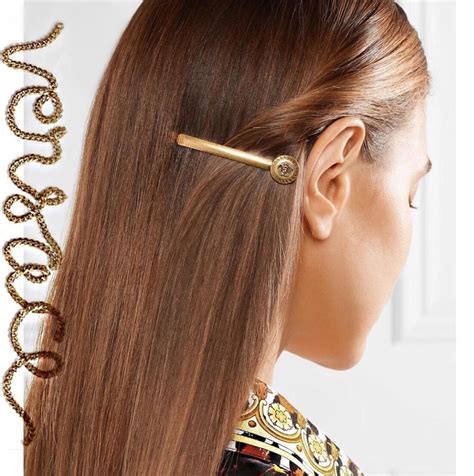 versace hair clips.